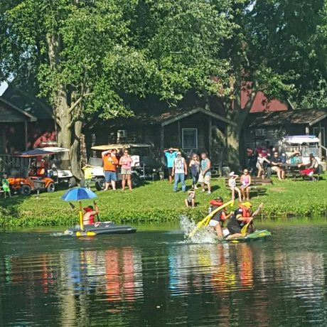 Children having fun in the pond