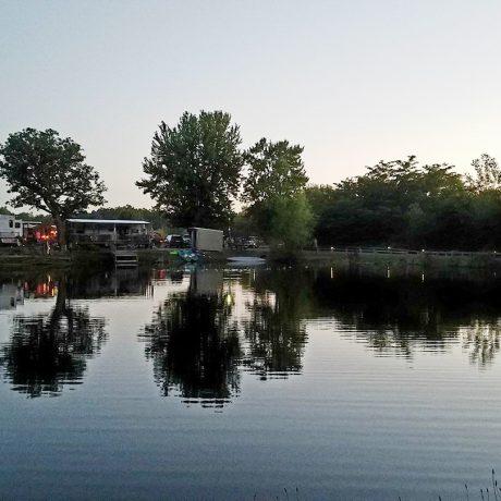 view of RV sites along the pond at Shady Lakes RV Resort